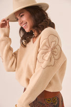 MAGLIA CON FIORE SULLA MANICA - NKN